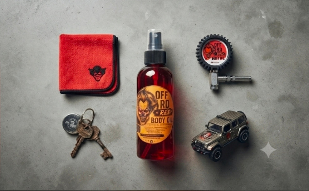 The Riot Act Off-Road Red Body Oil Skin Oil bottle surrounded by keys, a cloth, and a toy car.